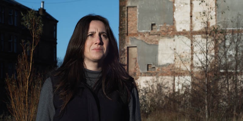 Louise looks at her parents' house